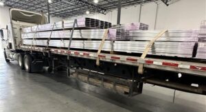 Truck carrying machined aluminum.