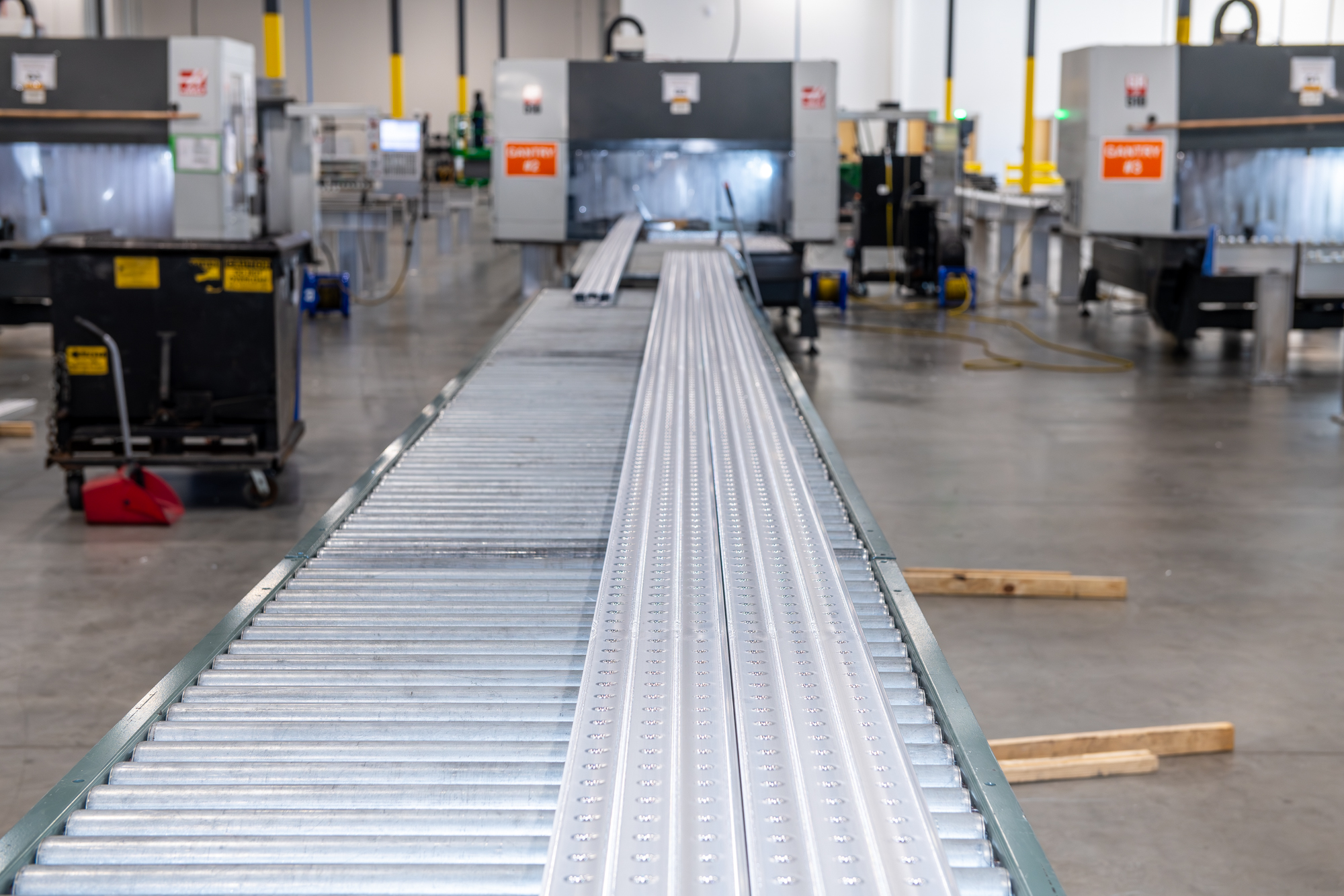 Machined aluminum parts on rollers